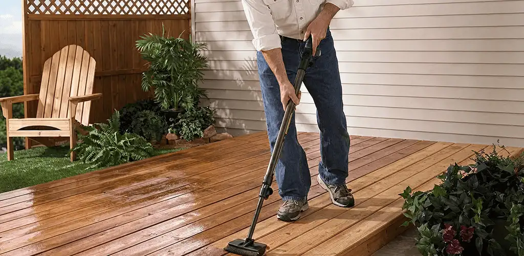 Deck staining service applying stain to a backyard wood deck in Orlando, FL